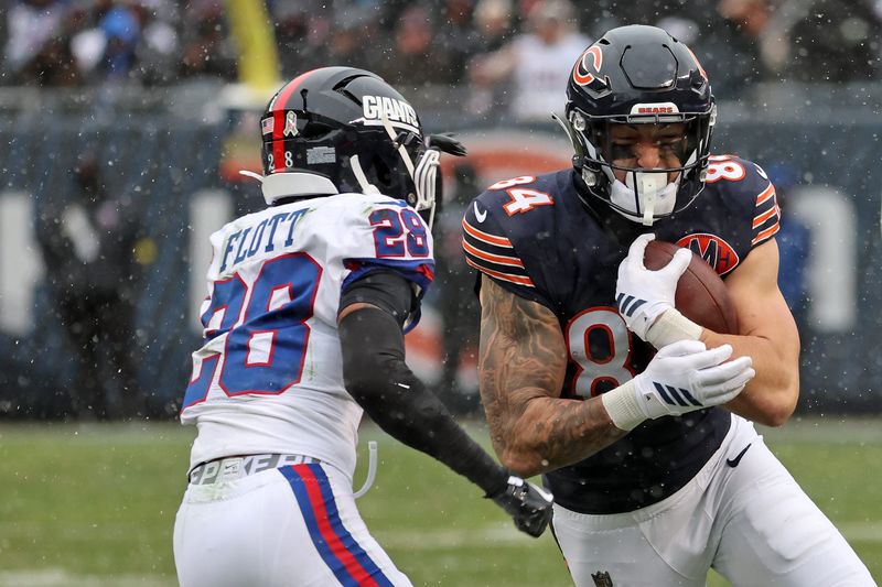 Nov 9, 2025; Chicago, Illinois, USA; Chicago Bears tight end Colston Loveland (84) makes a catch over New York Giants cornerback Cordale Flott (28) during the second half at Soldier Field. Mandatory Credit: Mike Dinovo-Imagn Images