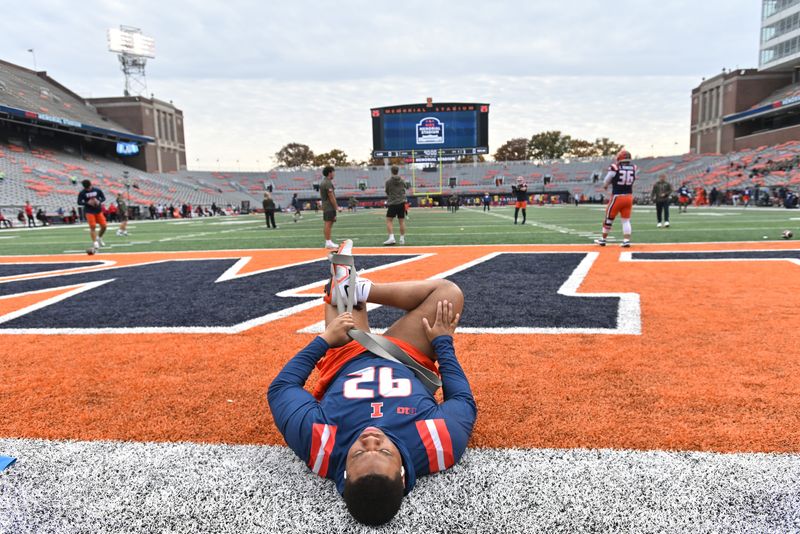 Nov 15, 2025; Champaign, Illinois, USA; Illinois Fighting Illini defensive lineman Gentle Hunt (92) stretches before a game against the Maryland Terrapins at Memorial Stadium. Mandatory Credit: Ron Johnson-Imagn Images