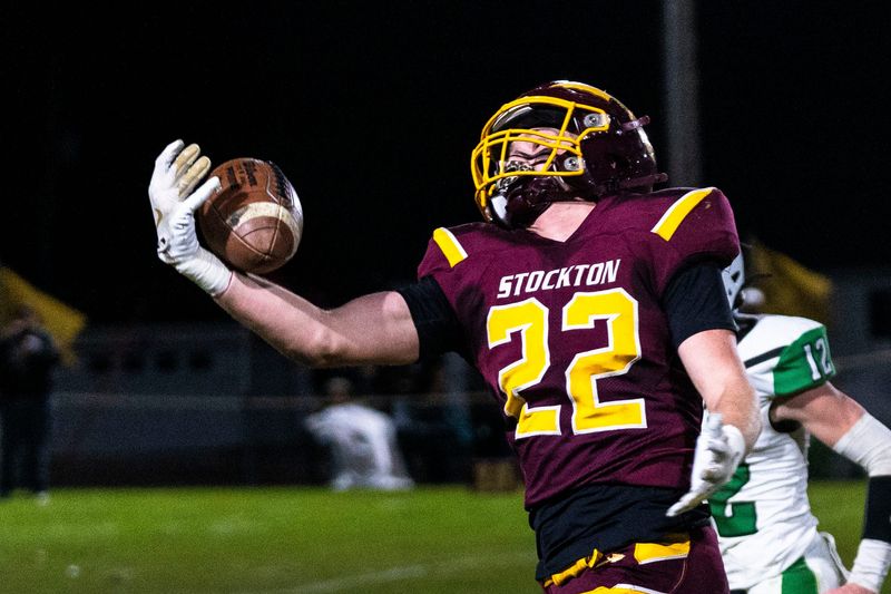 Stockton’s Eli Larson (22) catches a pass during a quarterfinal game against Dwight on Nov. 15, 2025, at Stockton High School.