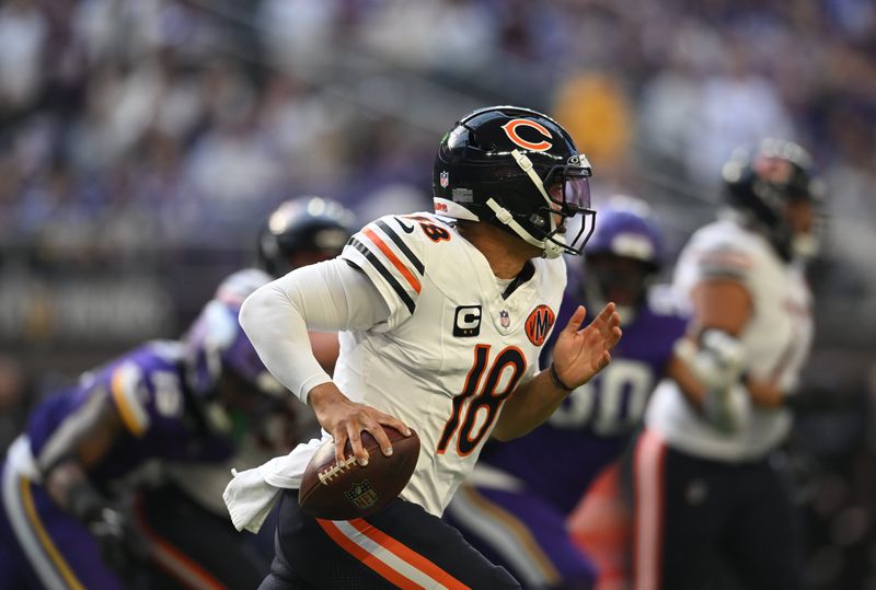 Nov 16, 2025; Minneapolis, Minnesota, USA; Chicago Bears quarterback Caleb Williams (18) runs in the pocket during the second quarter against the Minnesota Vikings at U.S. Bank Stadium. Mandatory Credit: Jeffrey Becker-Imagn Images