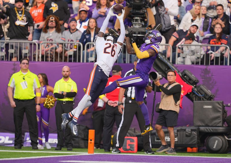 Nov 16, 2025; Minneapolis, Minnesota, USA; Chicago Bears cornerback Nahshon Wright (26) intercepts a pass intended for Minnesota Vikings wide receiver Jordan Addison (3) during the second quarter at U.S. Bank Stadium. Mandatory Credit: Brad Rempel-Imagn Images