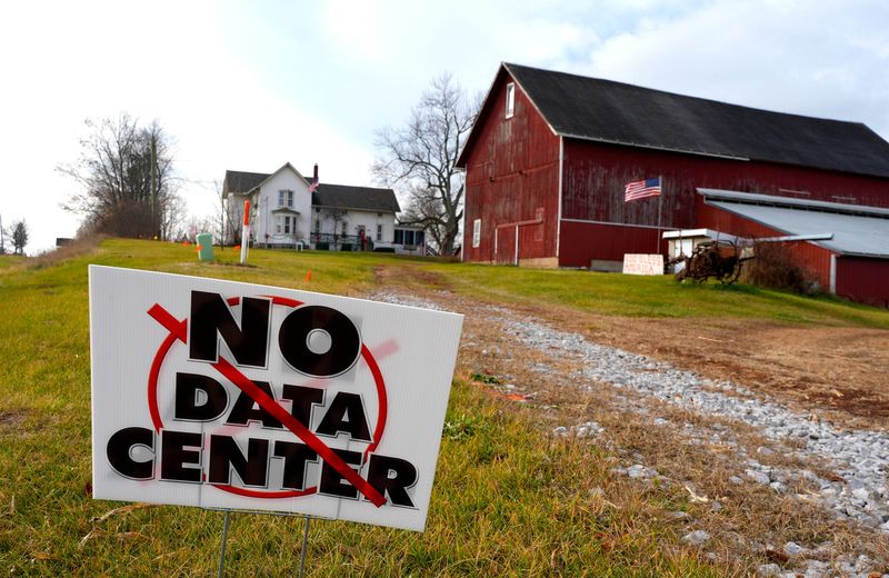One of several signs in the yards of homes off Michigan Avenue in Saline, where many residents are opposed to a proposed DTE data center. The sign is shown on Friday, Nov. 21, 2025,