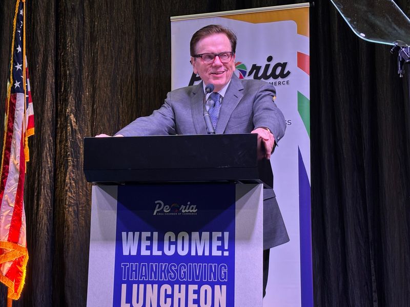 Dr. James McGee, recipient of the Peoria Area Chamber of Commerce 2025 Tom Connor Service Award, addresses the attendees at the annual Chamber Thanksgiving luncheon and awards ceremony Thursday.
