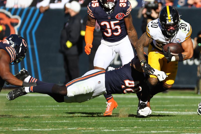Nov 23, 2025; Chicago, Illinois, USA; Pittsburgh Steelers running back Jaylen Warren (30) rushes the ball against the Chicago Bears during the second half at Soldier Field. Mandatory Credit: Mike Dinovo-Imagn Images