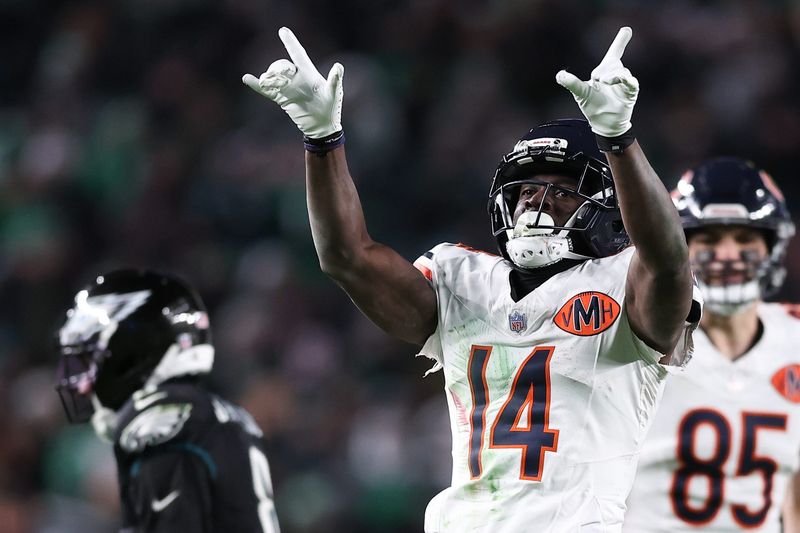 Nov 28, 2025; Philadelphia, Pennsylvania, USA; Chicago Bears wide receiver Olamide Zaccheaus (14) celebrates a first down against the Philadelphia Eagles during the fourth quarter of the game at Lincoln Financial Field. Mandatory Credit: Bill Streicher-Imagn Images