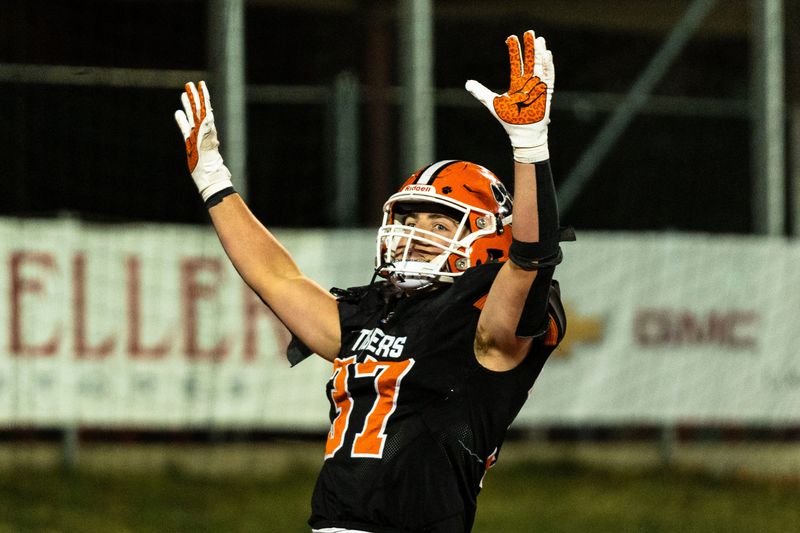 Byron’s Caden Considine (37) puts his hands up in celebration during the IHSA 3A football state championship game against Tolono Unity on Nov. 28, 2025, at Illinois State University in Normal.