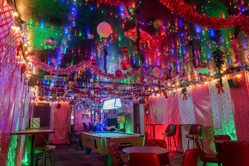 Christmas lights, ornaments, tinsel and even a present cling to the ceiling at City Heat, 2248 W. Glen Avenue in Peoria.