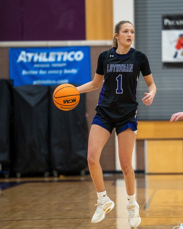 Soraya Parker dribbles the ball up the court during an early-season girls basketball game.
