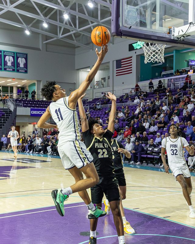 Principia Panthers guard Quentin Coleman (11) goes for a lay up during a City of Palms Classic semifinal game against the Paul VI Panthers at Suncoast Credit Union Arena in Fort Myers, Fla., on Monday, Dec. 22, 2025.