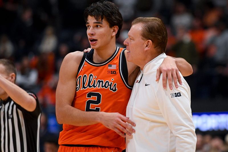Dec 6, 2025; Nashville, Tennessee, USA; Illinois Fighting Illini guard Andrej Stojakovic (2) celebrates the win with head coach Brad Underwood against the Tennessee Volunteers during the second half at Bridgestone Arena. Mandatory Credit: Steve Roberts-Imagn Images