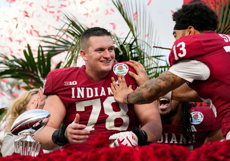 Indiana Hoosiers offensive lineman Pat Coogan (78) celebrates being awarded MVP with Indiana Hoosiers wide receiver Elijah Sarratt (13) on Thursday, Jan. 1, 2026, during the 112th annual Rose Bowl game in Pasadena. Indiana Hoosiers defeated Alabama Crimson Tide, 38-3.