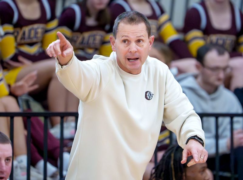 East Peoria head coach Jarrett Brown directs the Raiders as they battle Peoria High in the second half of their high school basketball game Saturday, Jan. 3, 2026 at Peoria High School. The Lions defeated the Raiders 65-61.