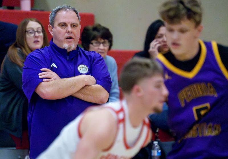Peoria Christian head coach Jason Persinger watches his Chargers battle Brimfield in the first half of their high school basketball game Tuesday, Jan. 6, 2026 at Brimfield High School. The Chargers defeated the Indians 43-38.