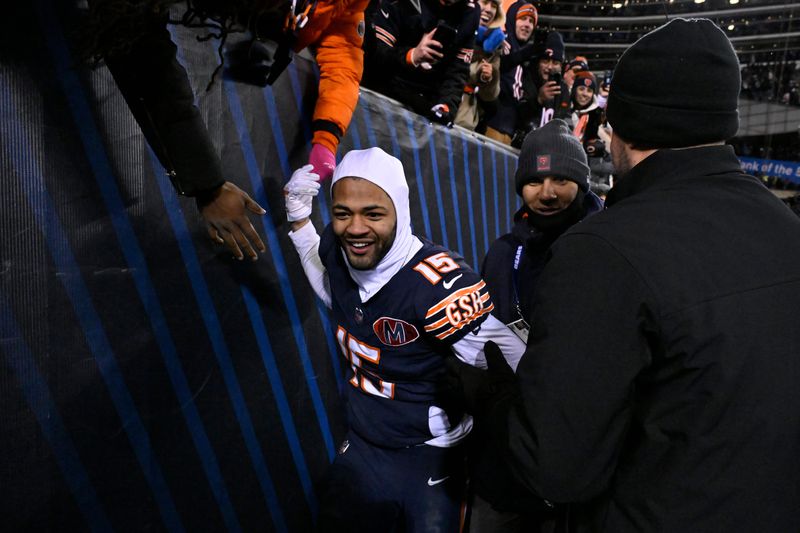 Jan 10, 2026; Chicago, IL, USA; Chicago Bears wide receiver Rome Odunze (15) high fives fans following an NFC Wild Card Round game against the Green Bay Packers at Soldier Field. Mandatory Credit: Matt Marton-Imagn Images