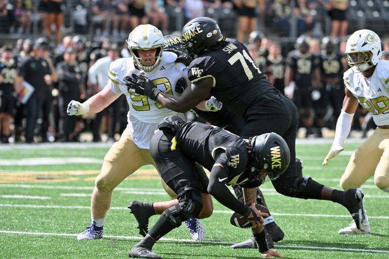 Sep 27, 2025; Winston-Salem, North Carolina, USA; Wake Forest Demon Deacons offensive lineman Melvin Siani (71) blocks Georgia Tech Yellow Jackets defensive lineman Jordan van den Berg (99) during the fourth quarter at Allegacy Federal Credit Union Stadium. Mandatory Credit: Zachary Taft-Imagn Images