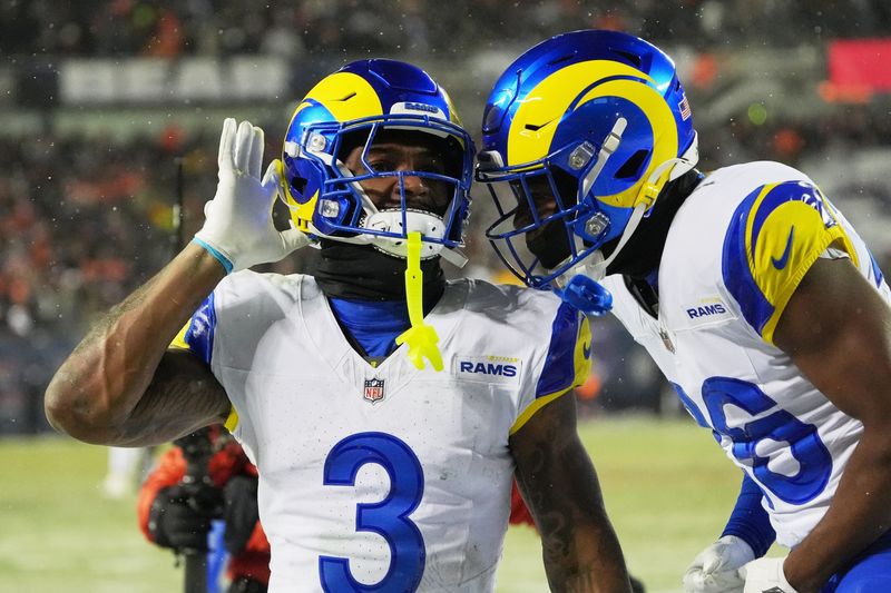 Jan 18, 2026; Chicago, IL, USA; Los Angeles Rams safety Kam Curl (3) acknowledges the crowd with safety Kamren Kinchens (26) after intercepting a pass intended for Chicago Bears wide receiver DJ Moore (not pictured) during overtime of an NFC Divisional Round game at Soldier Field. Mandatory Credit: David Banks-Imagn Images
