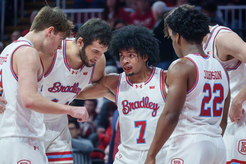 Bradley's Montana Wheeler (7), sporting a bloody lip, tries to rally his teammates in the second half of their college basketball game Saturday, Jan. 24, 2026 at Carver Arena. The Braves fell to the Flames 85-70.