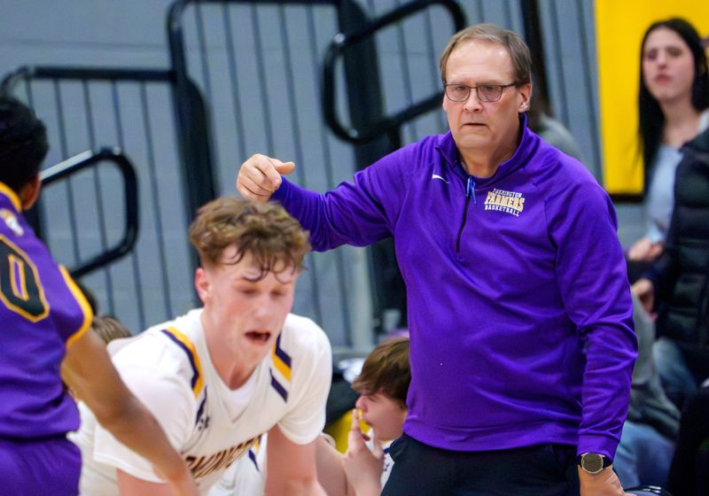 Farmington head coach Marty Lozier watches the action as the Farmers battle Peoria Christian in the second half of their high school basketball game Friday, Feb. 13, 2026 in Farmington. The Farmers defeated the Chargers 75-65.