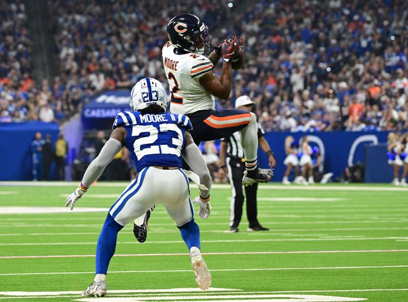 Sep 22, 2024; Indianapolis, Indiana, USA; Chicago Bears wide receiver DJ Moore (2) catches a pass in front of Indianapolis Colts cornerback Kenny Moore II (23) during the second half at Lucas Oil Stadium. Mandatory Credit: Marc Lebryk-Imagn Images