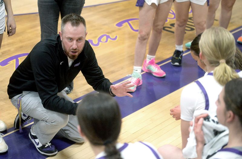 Mount Pulaski's coach Ryan McVickers talks to his team during a time out at the game against Stewardson-Strasburg Thursday, Feb. 19, 2026.