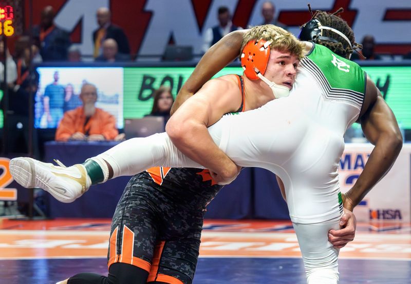 Washington's Wyatt Medlin takes on New Lenox Providence Catholic's Jasper Harper in the 165-pound title match of the Class 2A state wrestling championships Saturday, Feb. 21, 2026 at the State Farm Center in Champaign. Wyatt took the title with a 19-3 technical fall.