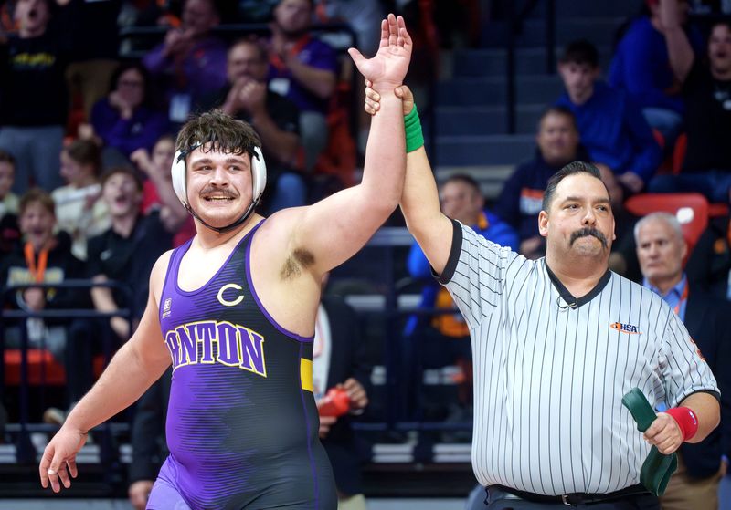 Canton's Connor Williams celebrates his victory over Lena-Winslow/Stockton's Jeremiah Luke in the 285-pound title match of the Class 1A state wrestling championships Saturday, Feb. 21, 2026 at the State Farm Center in Champaign.