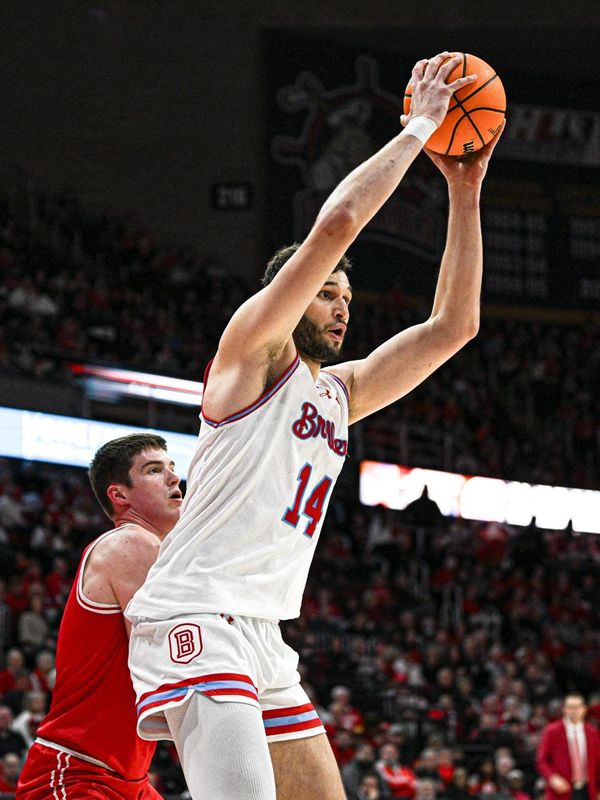 Bradley Braves 7-foot-1 center Ahmet Jonovic backs in for points against 6-foot-5 ISU defender Landon Wolf during Bradley's 74-60 victory over rival Illinois State in a Missouri Valley Conference game at Carver Arena on Feb. 21, 2026.