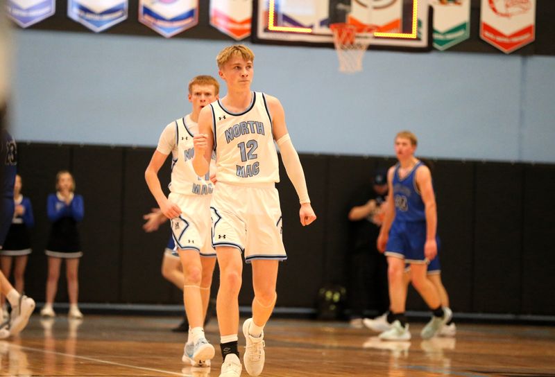 North Mac's Luke Alexander reacts after banking in a 3-pointer at the halftime buzzer against Petersburg PORTA/A-C Central in the Class 2A North Mac Regional semifinals on Wednesday, Feb. 25, 2026.