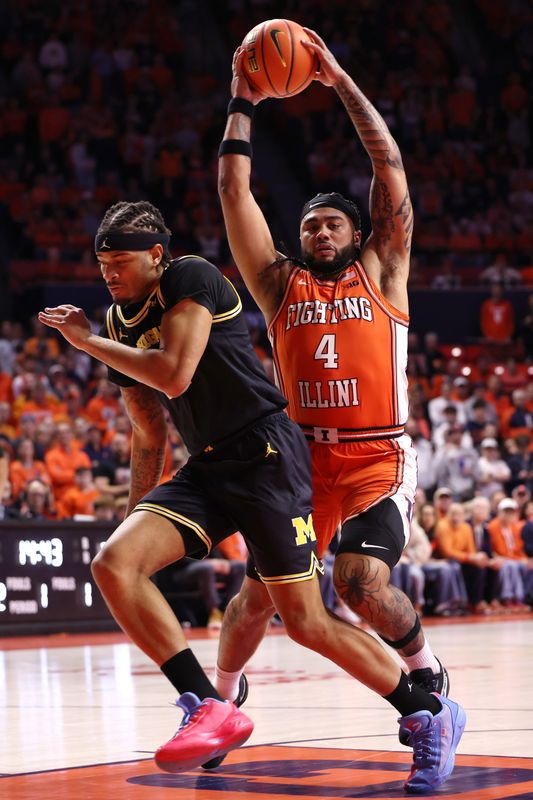 Kylan Boswell #4 of the Illinois Fighting Illini dribbles past Roddy Gayle Jr. #11 of the Michigan Wolverines during the first half at State Farm Center on February 27, 2026 in Champaign, Illinois.