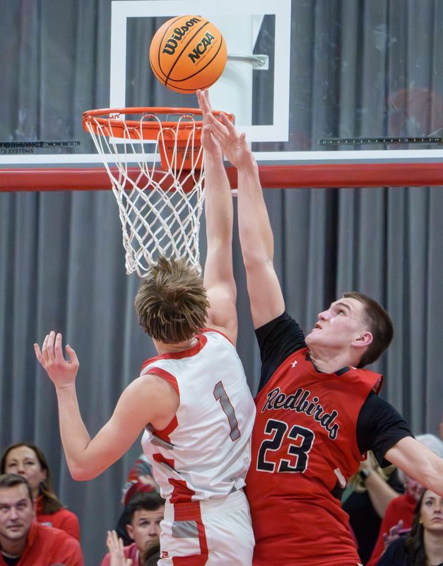 Morton's Jude Zeller (1) gets a shot past Metamora's Brady Jones in the second half of their Class 3A boys basketball regional title game Friday, Feb. 27, 2026 in Morton. The Potters advanced to the Ottawa Sectional with a 55-42 win.
