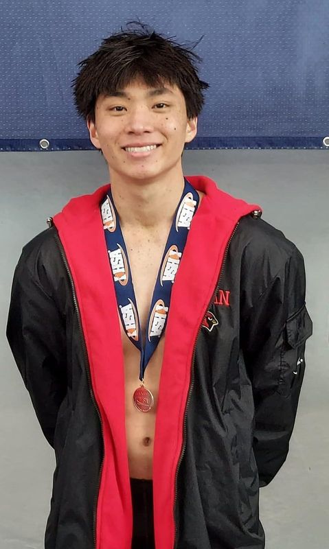 Kenan Nowak of the Metamora Co-op poses with his 11th-place medal in diving from the 2026 IHSA boys swimming and diving team state finals. He is the 2026 Journal Star swimming and diving athlete of the year.