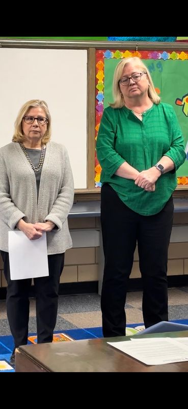 St. Patrick Catholic School Board Vice-President Cindy Lamar, left, and Principal Bridget Timoney listen as Board President Erik Woehrmann addresses the media at the school on March 5, 2026. St. Patrick's, founded in 1910, will close at the end of the academic year due to long-term financial sustainability challenges.