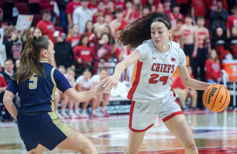Dee-Mack’s Dalia Dejesus, right, moves the ball against Rockford Christian’s Shea Ludwig in the first half of their Class 1A girls basketball state semifinals Thursday, March 5, 2026 at CEFCU Arena in Normal. Dee-Mack advanced to the state title game with a 48-35 win.