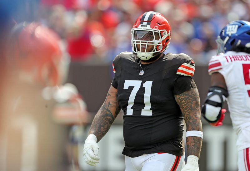 Browns offensive tackle Jedrick Wills Jr. heads back to the huddle after a play against the New York Giants, Sunday, Sept. 22, 2024, in Cleveland.