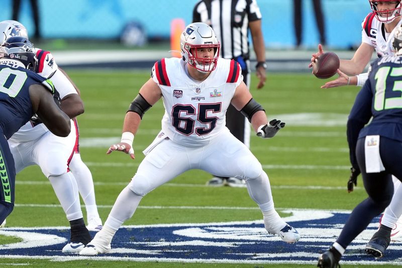 Feb 8, 2026; Santa Clara, CA, USA; New England Patriots center Garrett Bradbury (65) blocks against the Seattle Seahawks during the first quarter in Super Bowl LX at Levi's Stadium. Mandatory Credit: Darren Yamashita-Imagn Images