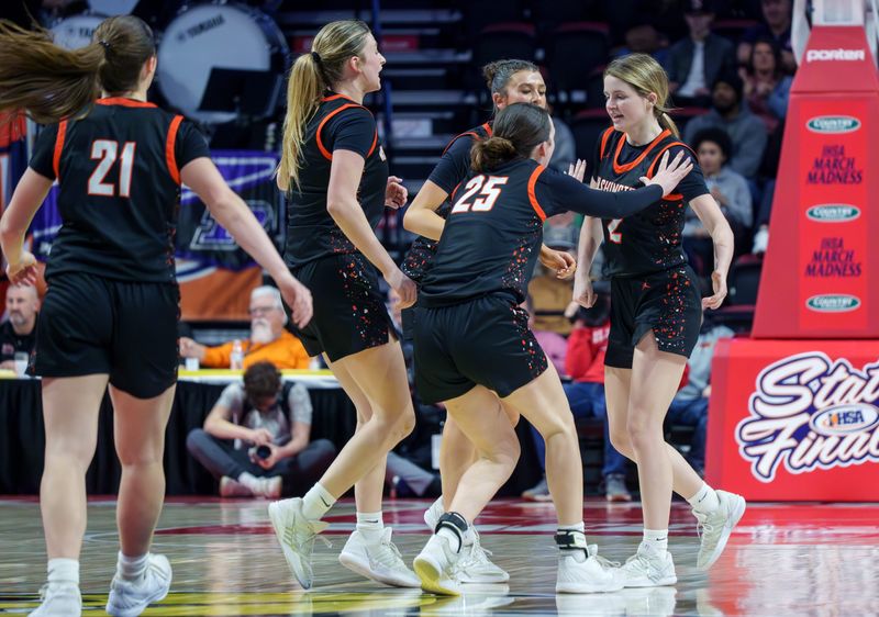 Washington’s Avery Tibbs, far right, gets some attention from her teammates after hitting a three-pointer against Chatham Glenwood late in the second half of the Class 3A girls high school basketball state title game Saturday, March 7, 2026 at CEFCU Arena in Normal. The Panthers defeated the Titans 60-45 for the title.