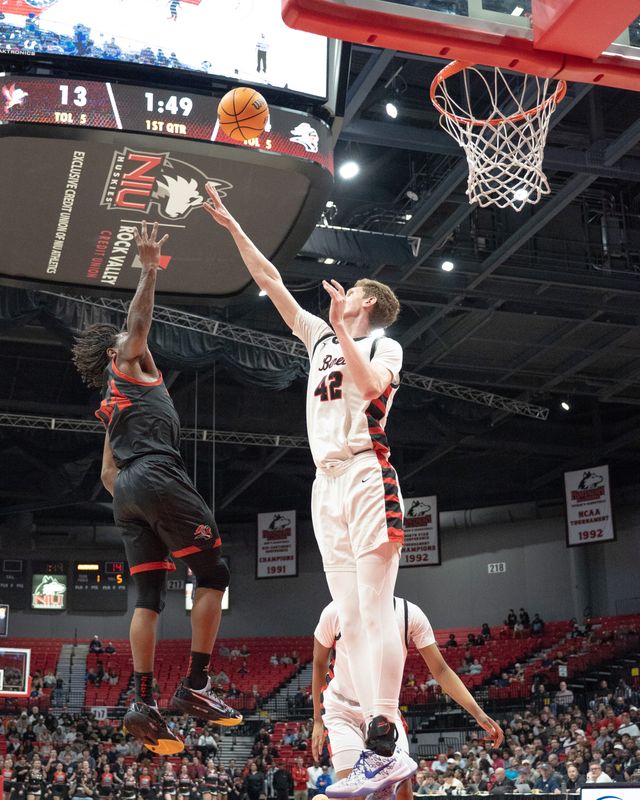 Rockford Auburn's Amir Danforth tries to get a shot over Benet Academy's 7-footer Colin Stack during the Class 4A DeKalb Super-Sectional on March 9, 2026, in DeKalb.