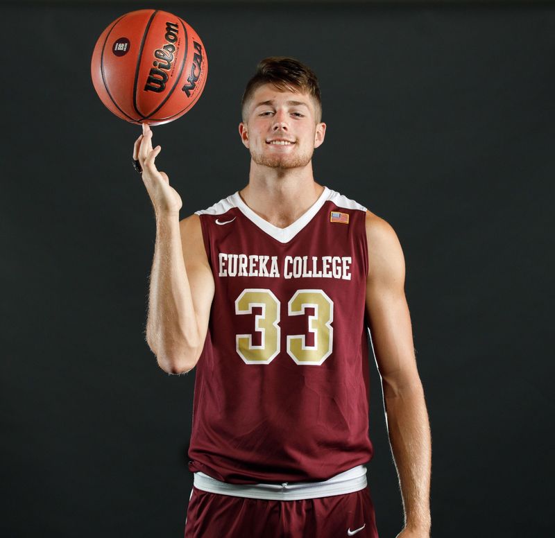 Kyler Stork spins the ball on his finger as he poses during Eureka College media day. The former EC men's basketball player is at MLB Spring Training as a first-year umpire.