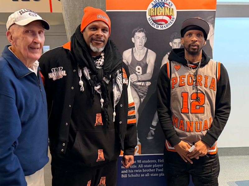 Manual Rams four-peat legacy Sergio McClain with former Rams 1994 and 1995 title teams member Ivan Watson and an Illini fan during Manual's IHSA state title game at State Farm Center in Champaign on March 14, 2026.