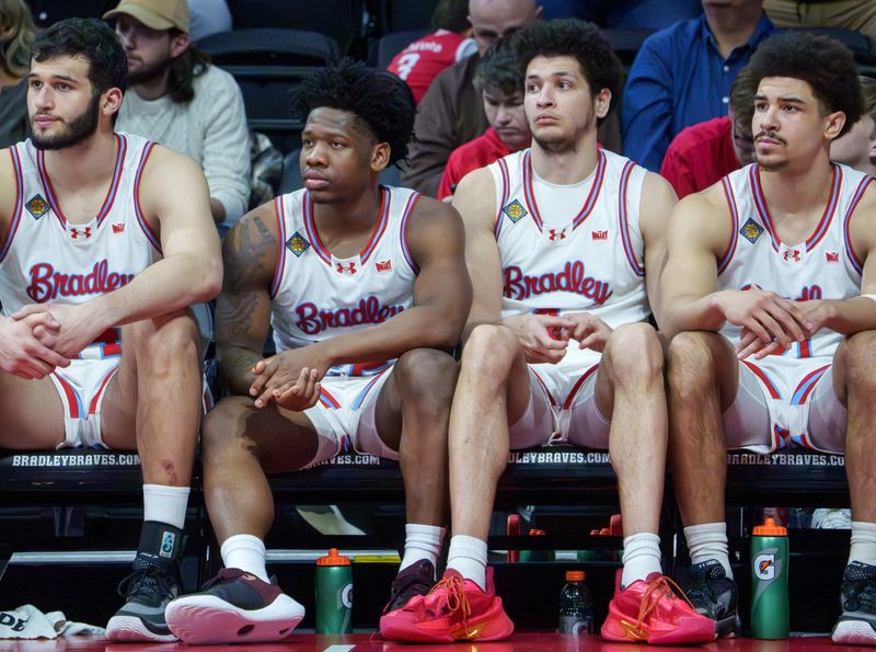 Bradley players, from left to right, Ahmet Jonovic, Jaquan Johnson, Corey Thomas and AJ Smith watch from the bench as time runs out in their first-round NIT game Wednesday, March 18, 2026 at Carver Arena in Peoria. The Braves were eliminated by the Dayton Flyers 80-66.