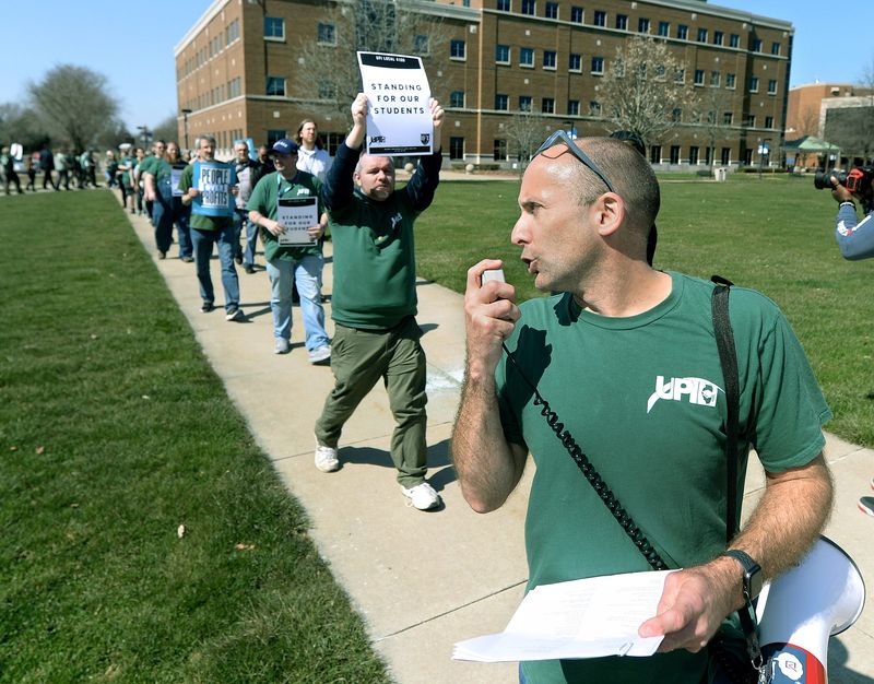 Associate Professor and Chapter President of UIS United Faculty Dathan Powell leads union workers in a rally in front of the University Plaza Thursday, March 19, 2026.