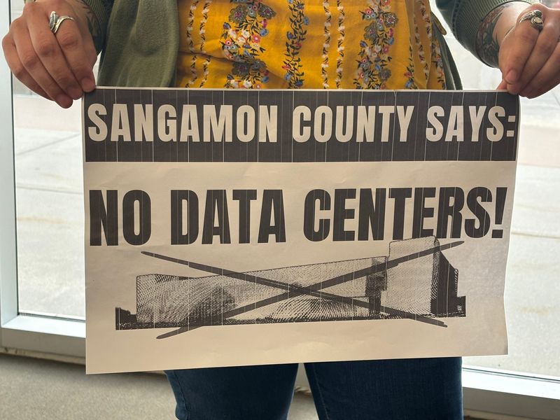 Protesting the proposed Sangamon County data center at the Bank of Springfield before the Sangamon County Board meeting on March 23, 2026.