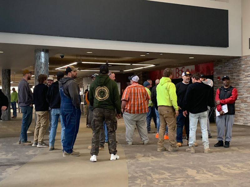 Union laborers stand ready to head into the BoS Center meeting room ahead of the data center vote on March 23, 2026.