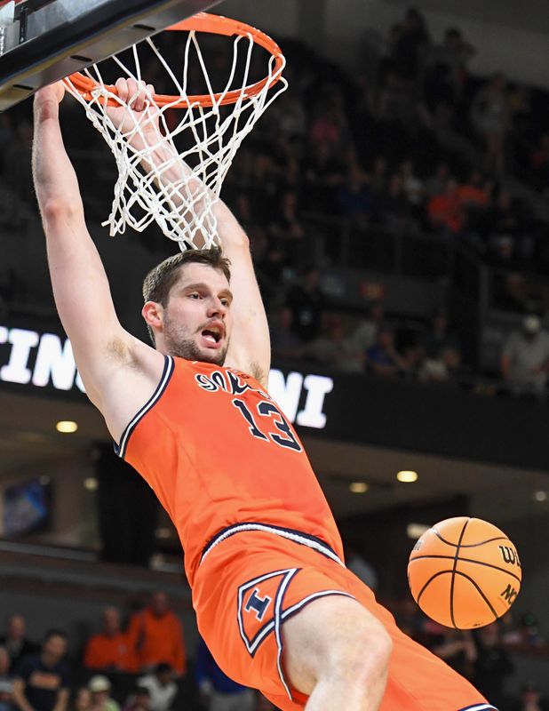 Illinois Fighting Illini center Tomislav Ivisic (13) dunks the ball Saturday, March 21, 2026, during the NCAA Men's Basketball Tournament second-round game against the VCU Rams at Bon Secours Wellness Arena in Greenville, South Carolina.