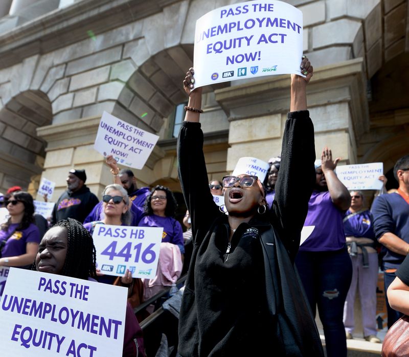 Rose Sammons of Chicago, right, attends a rally for the Unemployment Equality Act in front of the Illinois state Capitol Wednesday, March 25, 2026.