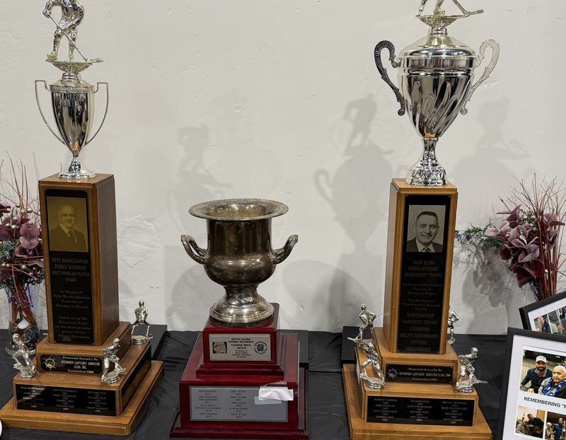 The Peoria Rivermen team awards, on display at the 2026 Rivermen Captain's Booster Club banquet, go back to the early 1980s, left to right, the Pete BardezBanian Award, the Bruce Saurs Leadership Award and the Mark Olson Trophy.