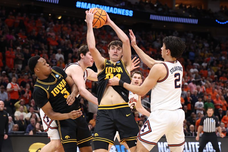 Iowa Hawkeyes guard Tate Sage (24) grabs a rebound against Illinois Fighting Illini guard Andrej Stojakovic (2) in the first half during an Elite Eight game of the South Region of the men's 2026 NCAA Tournament at Toyota Center.