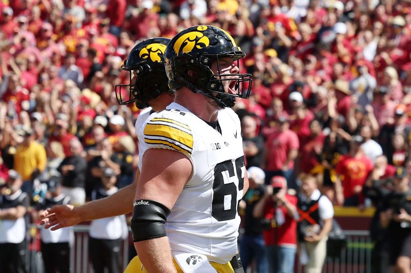 Sep 6, 2025; Ames, Iowa, USA; Iowa Hawkeyes offensive lineman Logan Jones (65) reacts after a play against the Iowa State Cyclones during the second half at Jack Trice Stadium. Mandatory Credit: Reese Strickland-Imagn Images