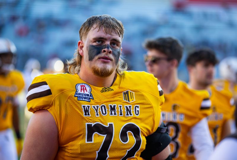 Dec 30, 2022; Tucson, AZ, USA; Wyoming Cowboys offensive tackle Caden Barnett (72) against the Ohio Bobcats during the 2022 Barstool Sports Arizona Bowl at Arizona Stadium. Mandatory Credit: Mark J. Rebilas-USA TODAY Sports