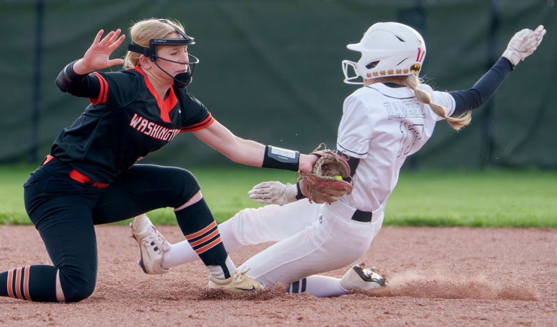 Washington’s Payton Swanson puts a tag on Metamora’s Ashley Damerell at second base during their high school softball game Tuesday, April 7, 2026 in Metamora. The ball came out of the glove and Damerell was safe on the play. The Panthers defeated the Redbirds 11-9.